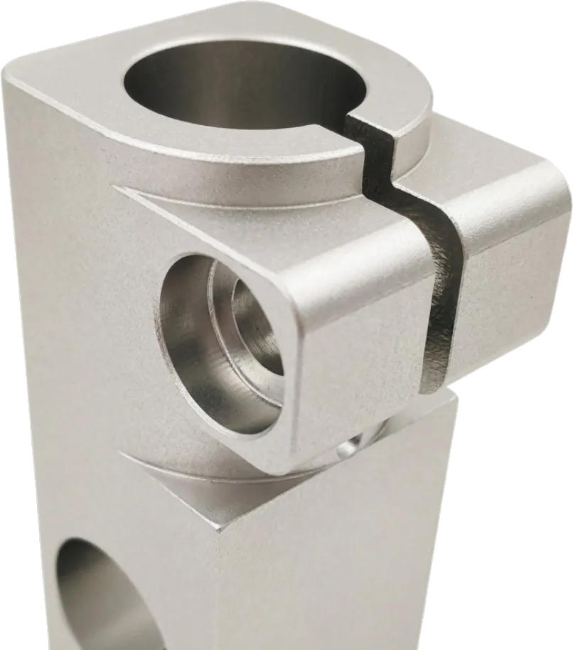 CNC machined aluminum swivel clamp block with a bored pivot.