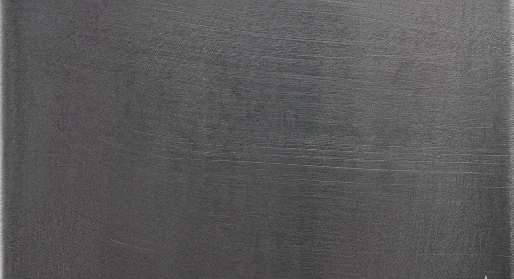 Dark carbon steel sheet metal surface swatch.