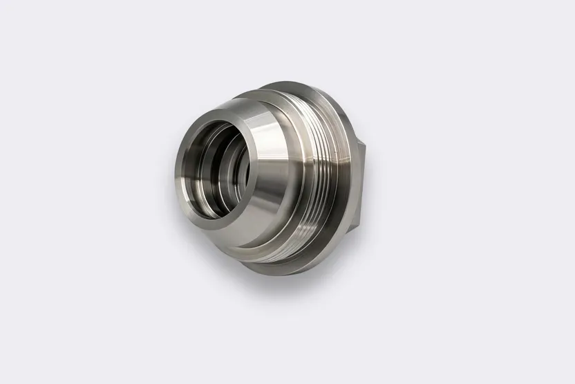 CNC machined aluminum alloy component with a threaded bore.