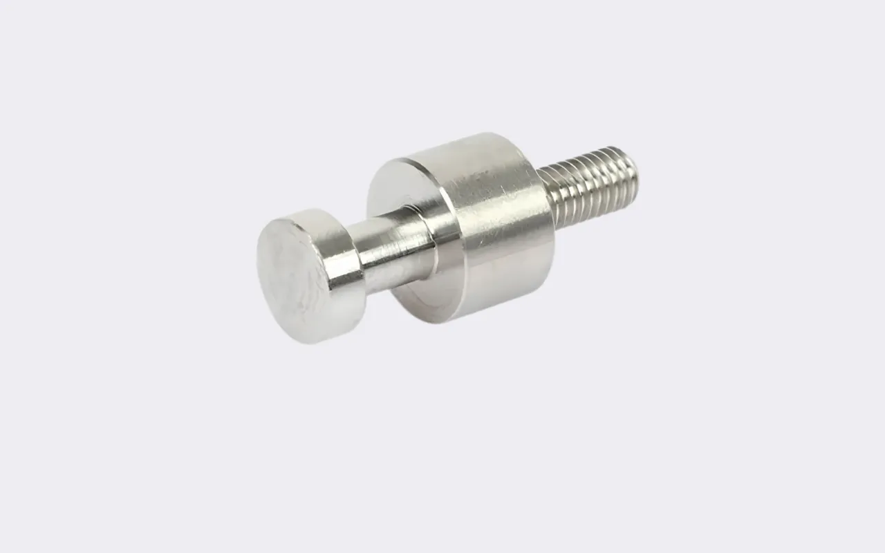 CNC machined titanium shoulder bolt with a threaded end.