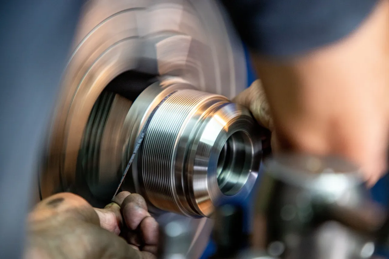 CNC turning operation machining a rotational metal component.
