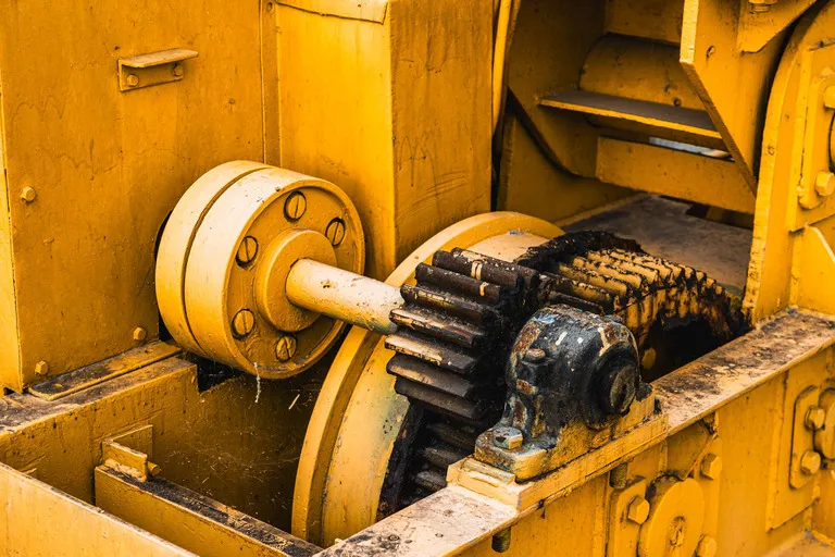 Gearbox assembly inside heavy industrial equipment.