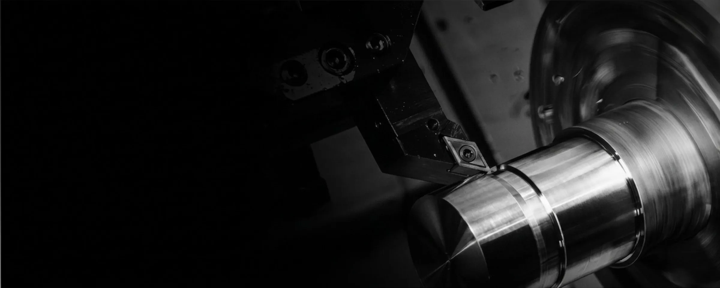 Precision CNC machining of a custom metal component on a lathe.