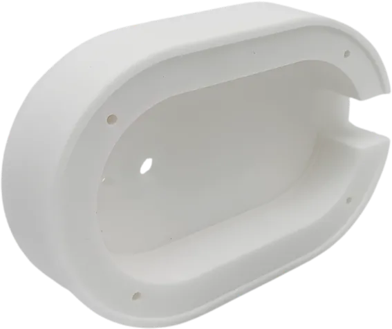 Machined PTFE housing with a rounded profile.