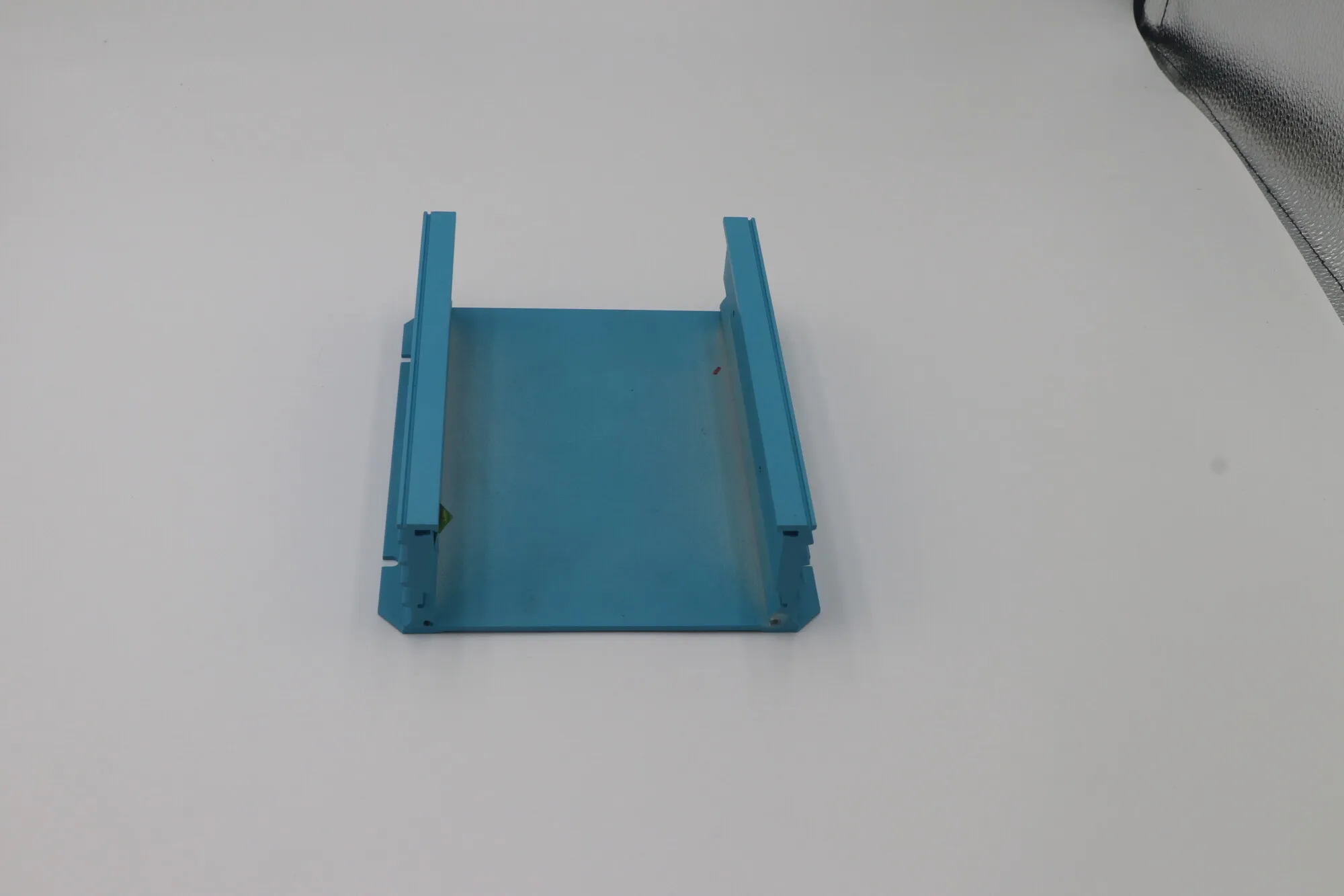 Blue anodized aluminum channel component with machined edges