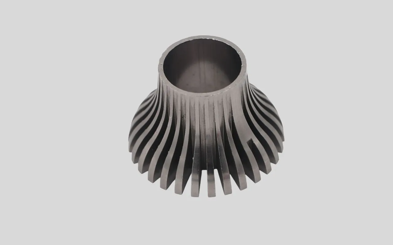 CNC machined aluminum heat sink with radial fin geometry.