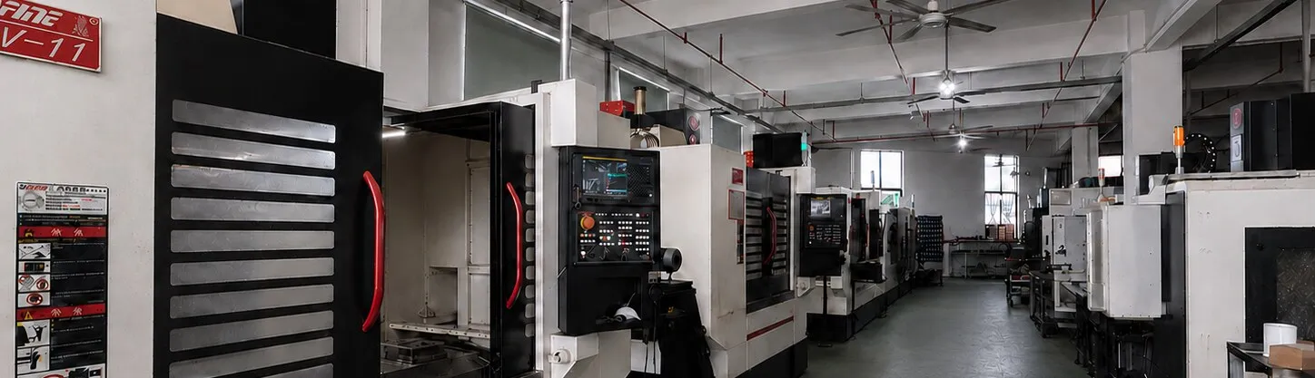 CNC machining centres lining the aisle of the Purespec workshop floor in Xiamen, China.