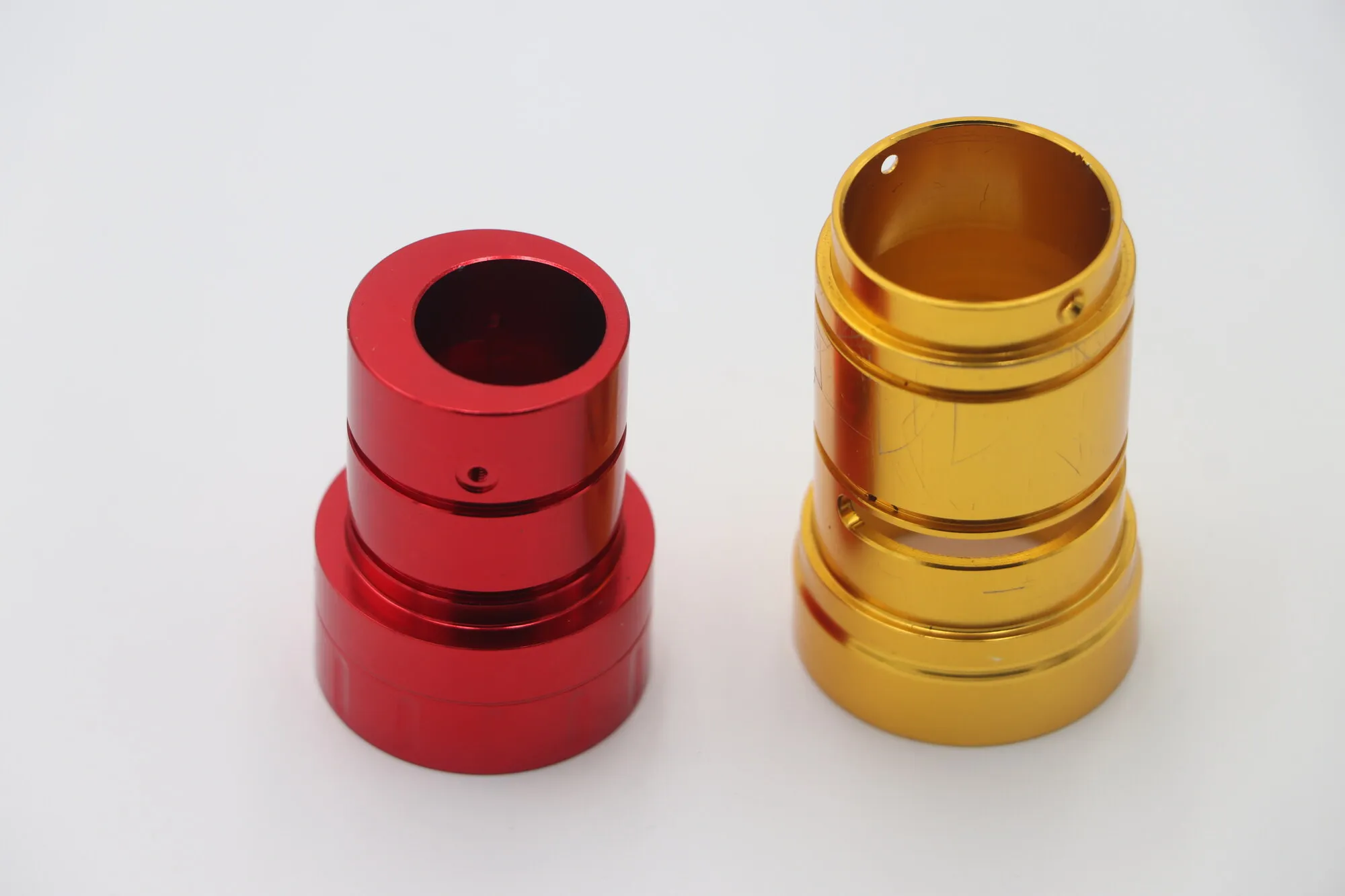 Red and gold anodized CNC turned aluminum stepped sleeves
