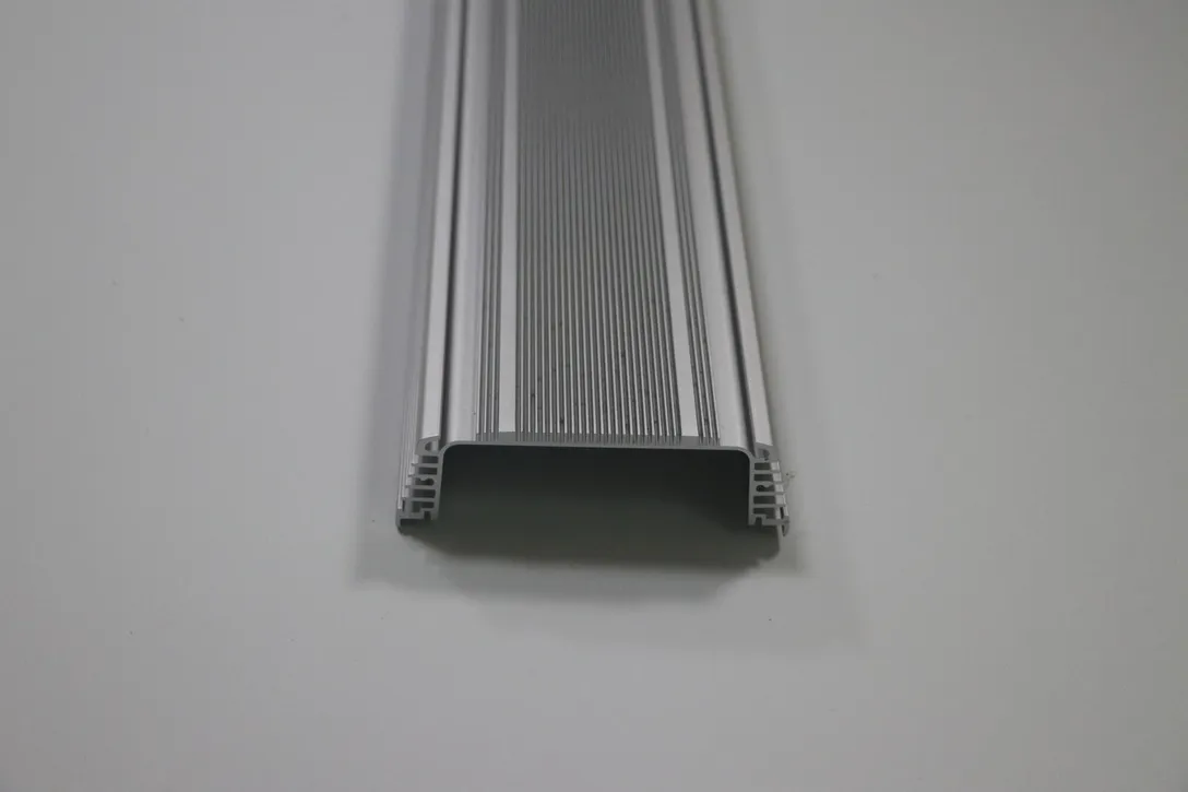 Extruded aluminum profile section with internal channels and machined ends