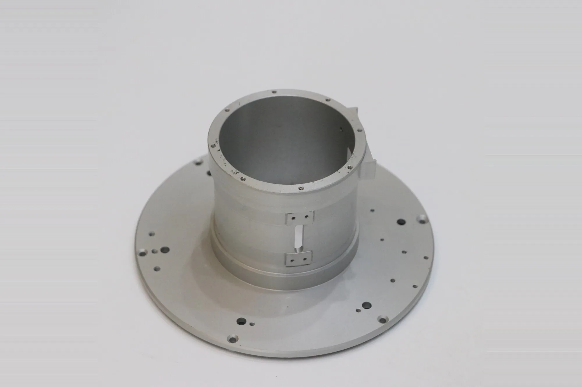 Large machined aluminum housing with turned bore, flanged base and drilled mounting pattern