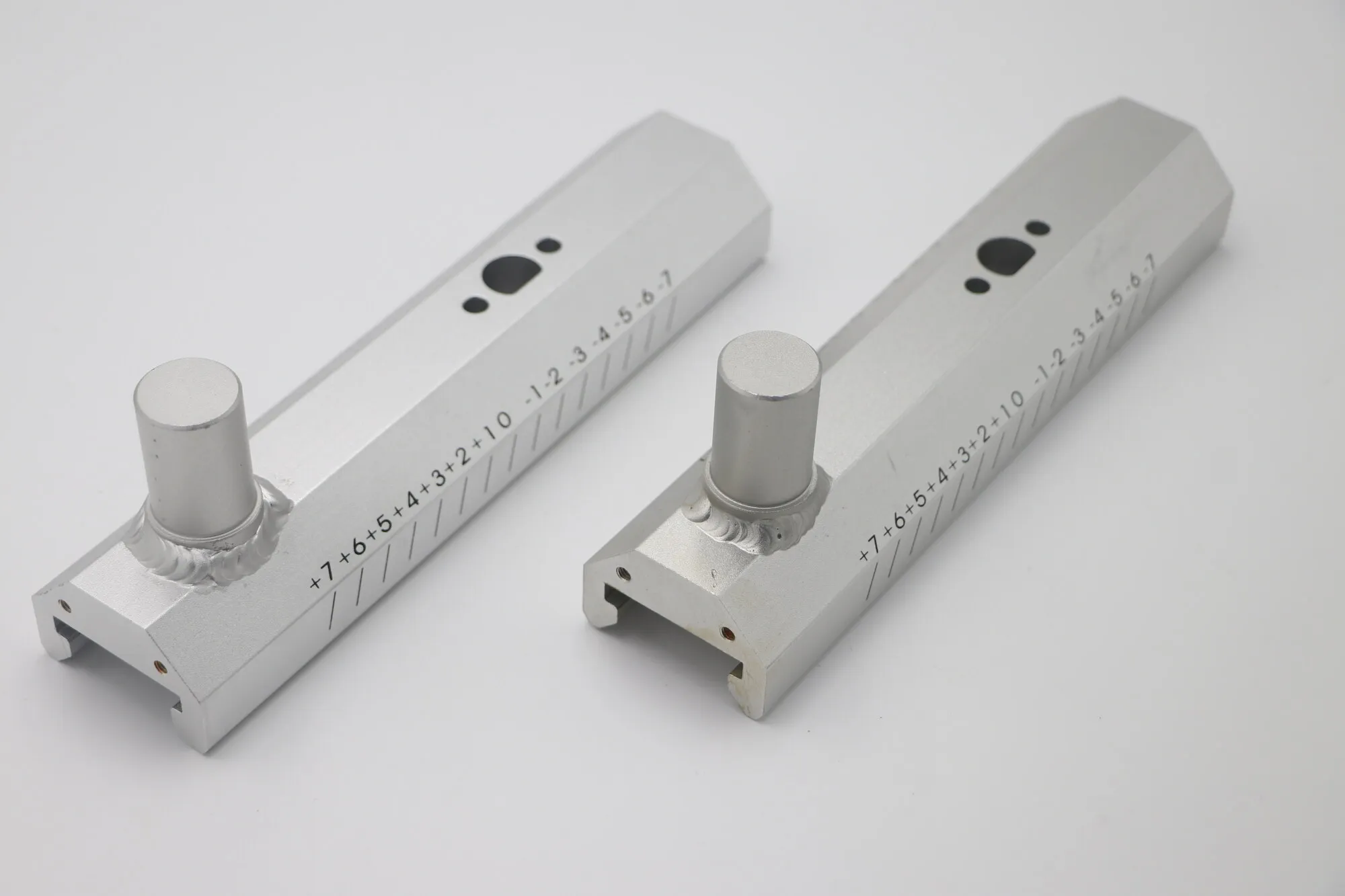 Machined aluminum measuring rails with laser-marked graduated scales