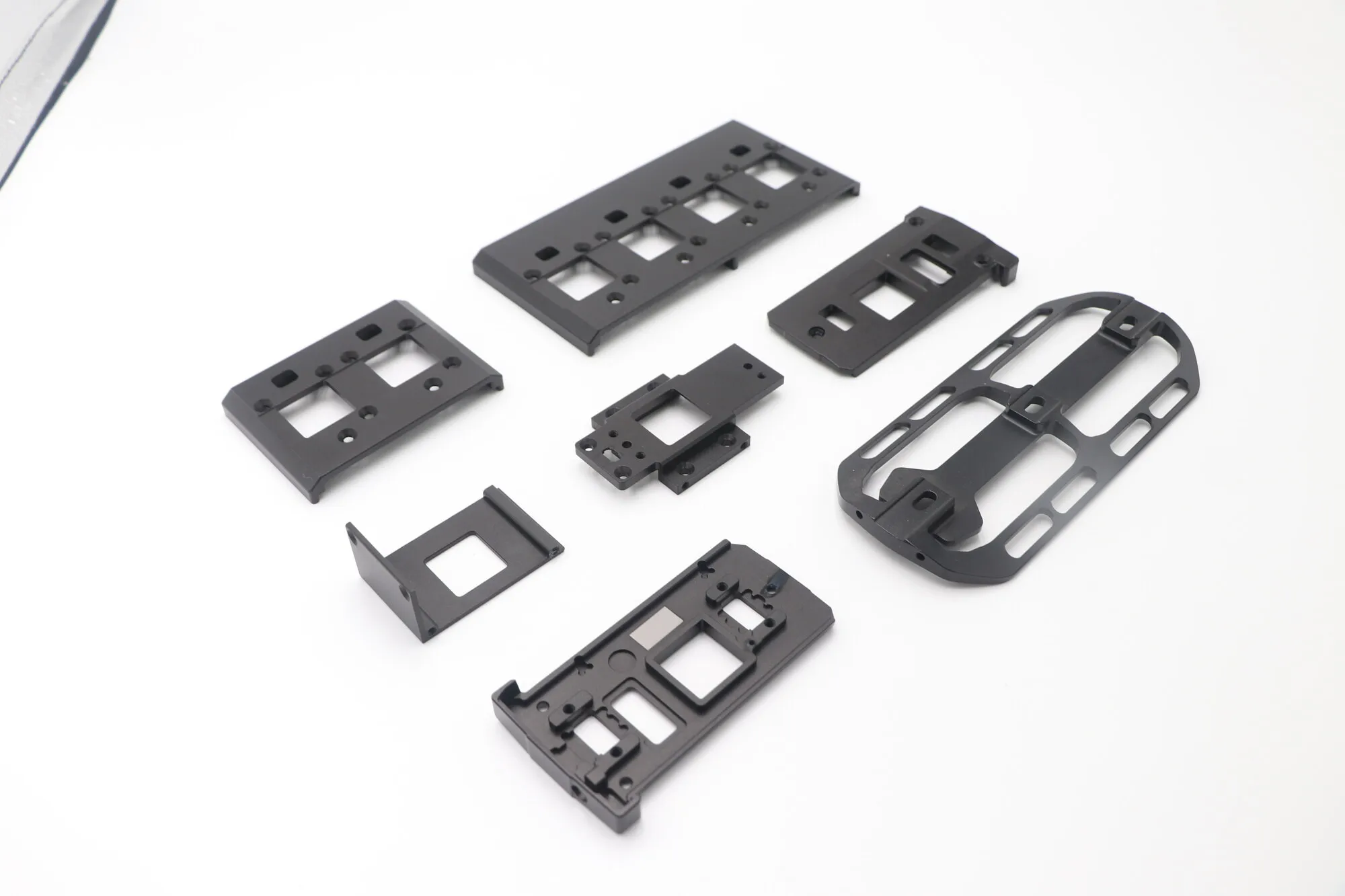 Set of lightweighted black anodized CNC milled aluminum plates