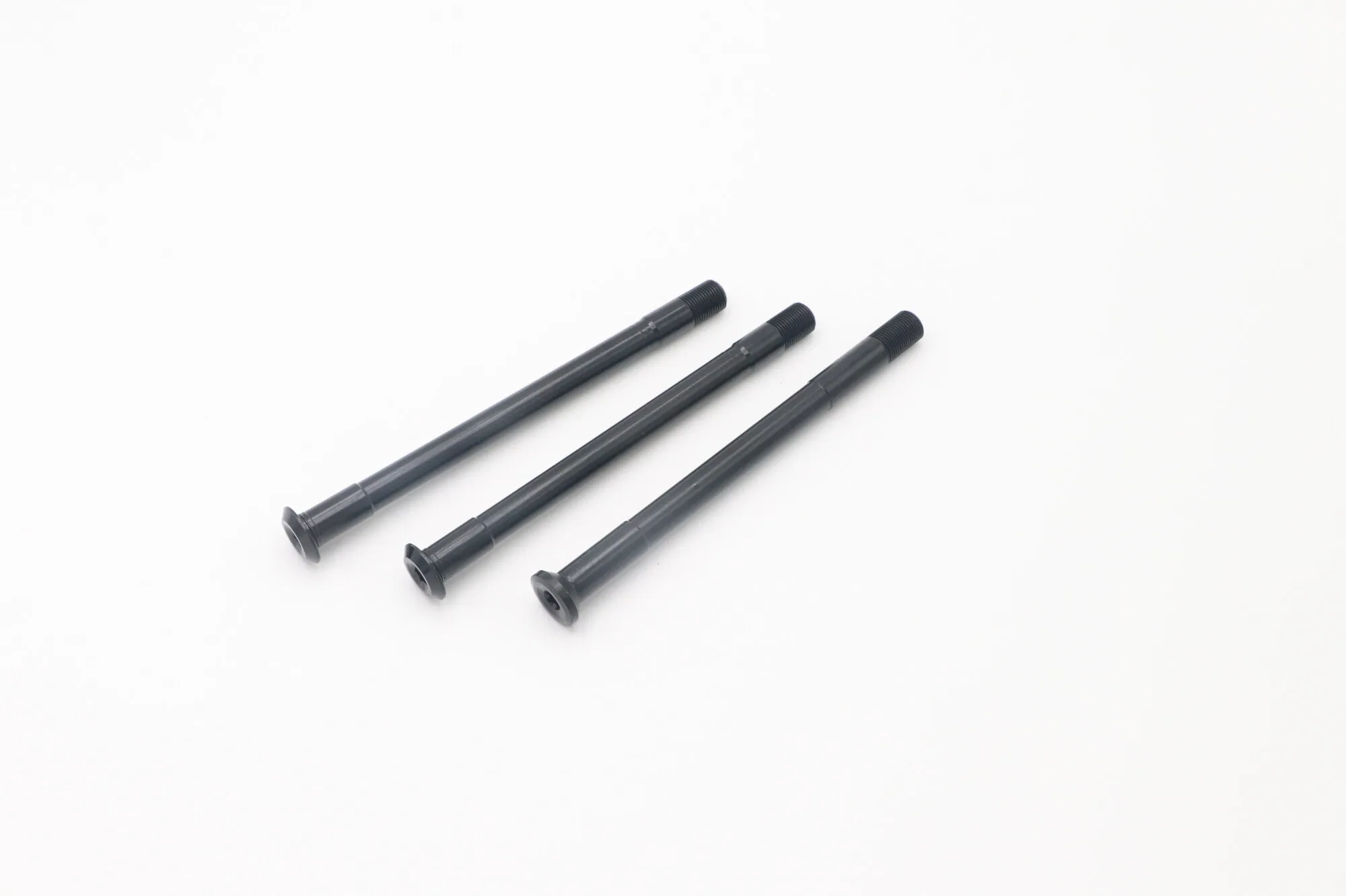 Long CNC turned aluminum axles and shoulder bolts with black anodized finish