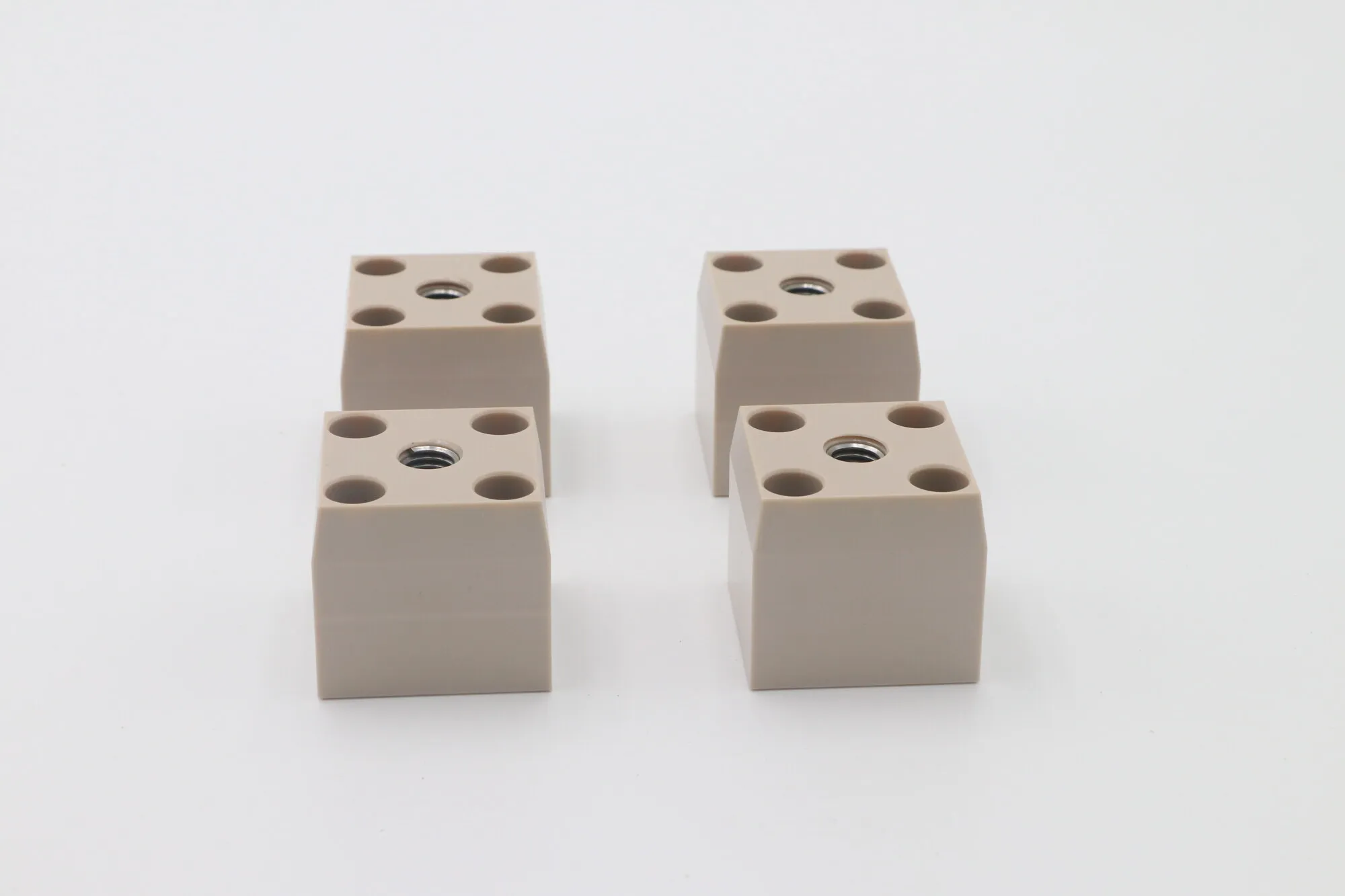 Machined PEEK blocks with tapped holes and counterbores