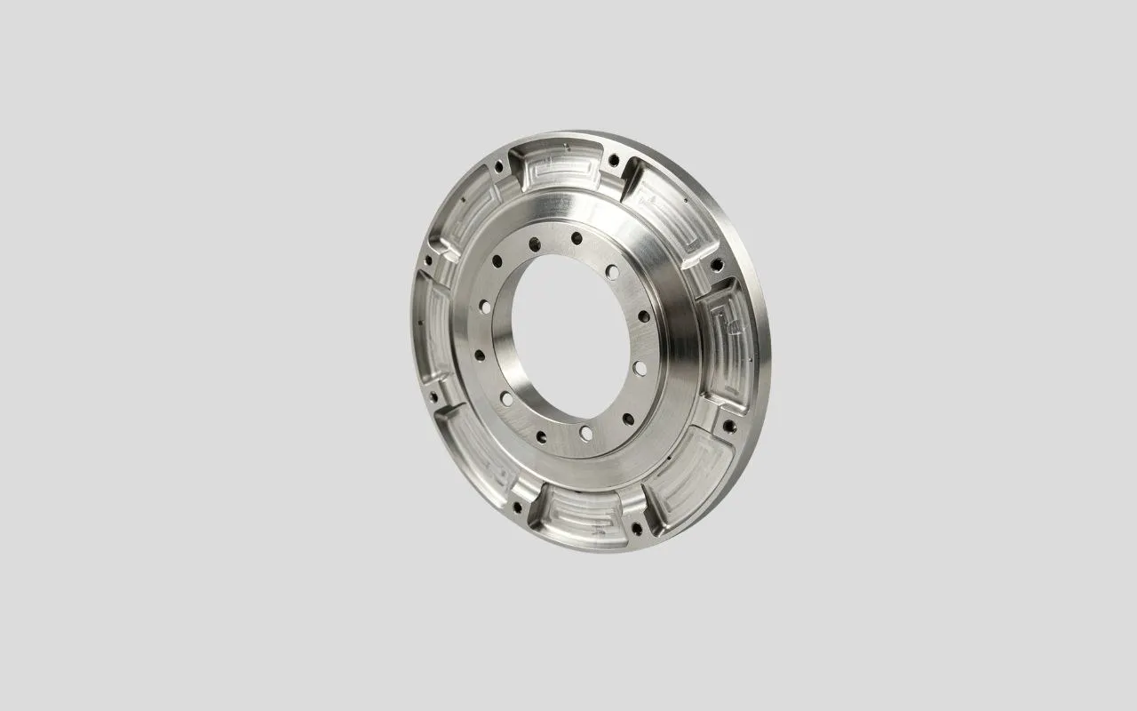 Precision CNC machined aluminum flange adapter plate with a bolt circle.