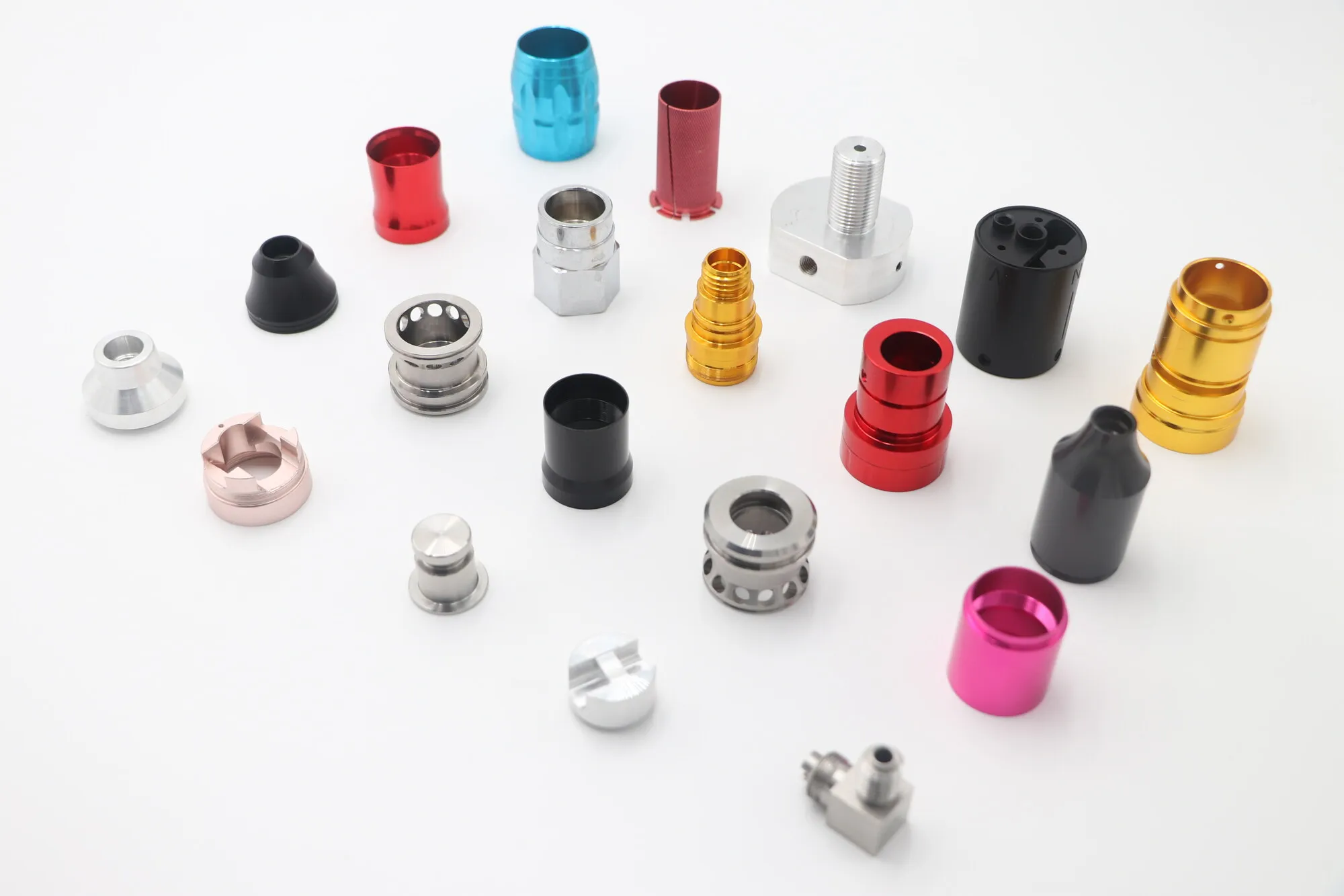 Batch of precision CNC turned aluminum fittings and bushings in mixed anodized colors