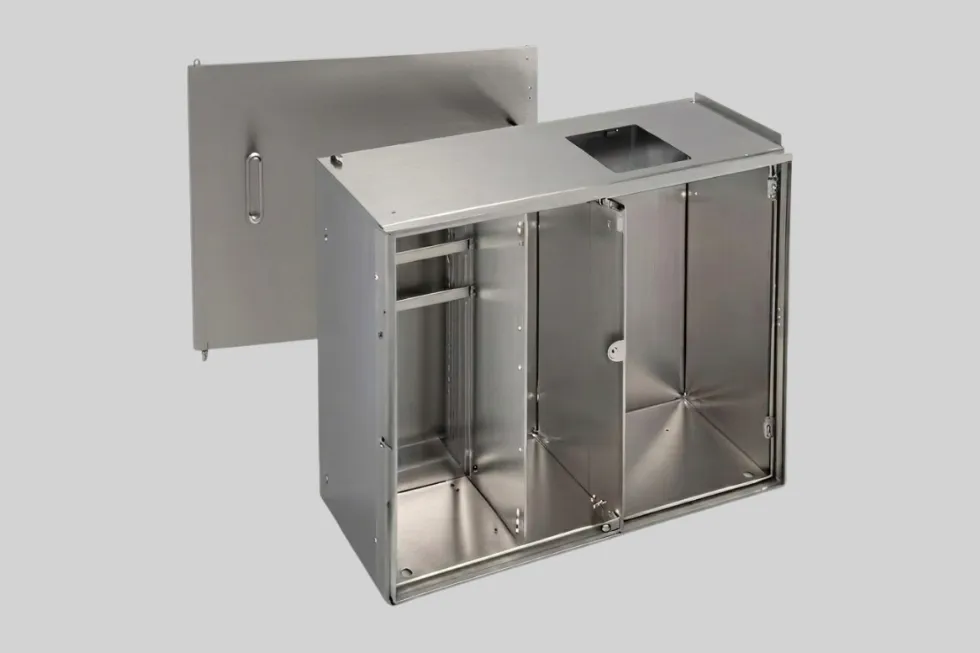 Stainless steel sheet metal electronic cabinet with a hinged door.