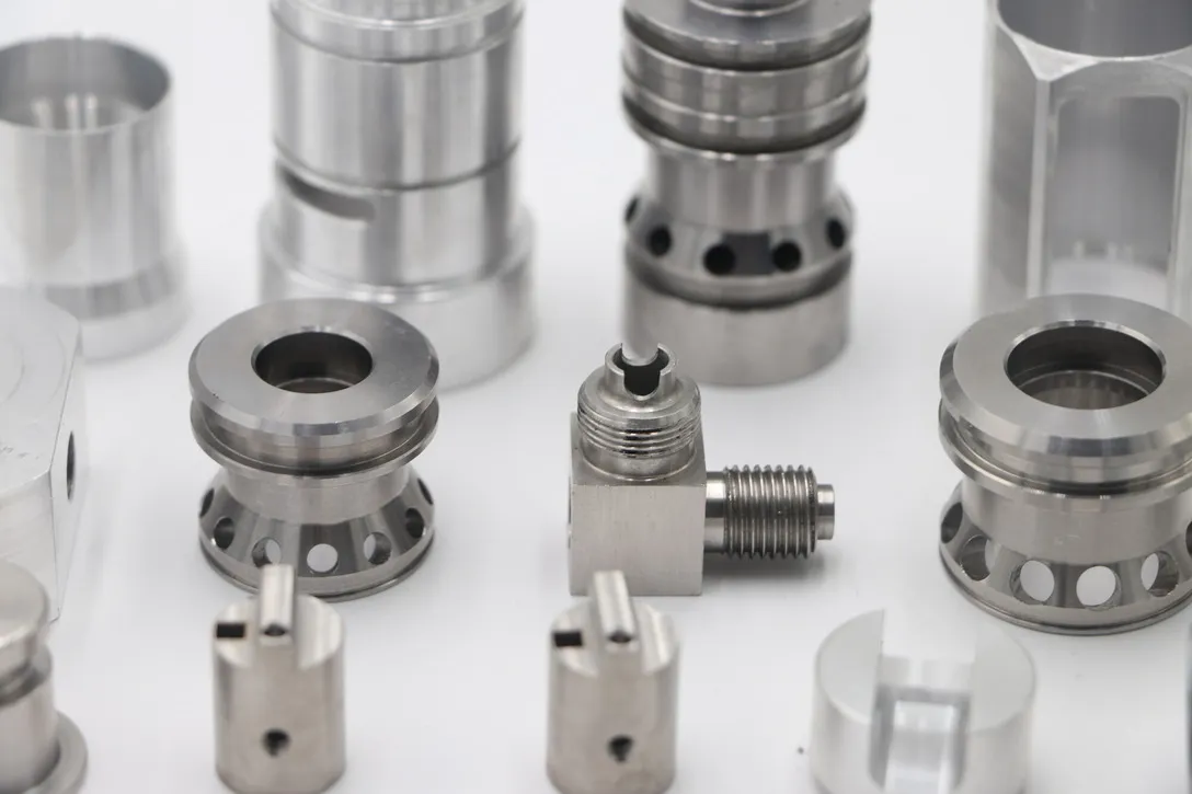 Machined stainless steel flow control components including sleeves, cages and cross-drilled bodies