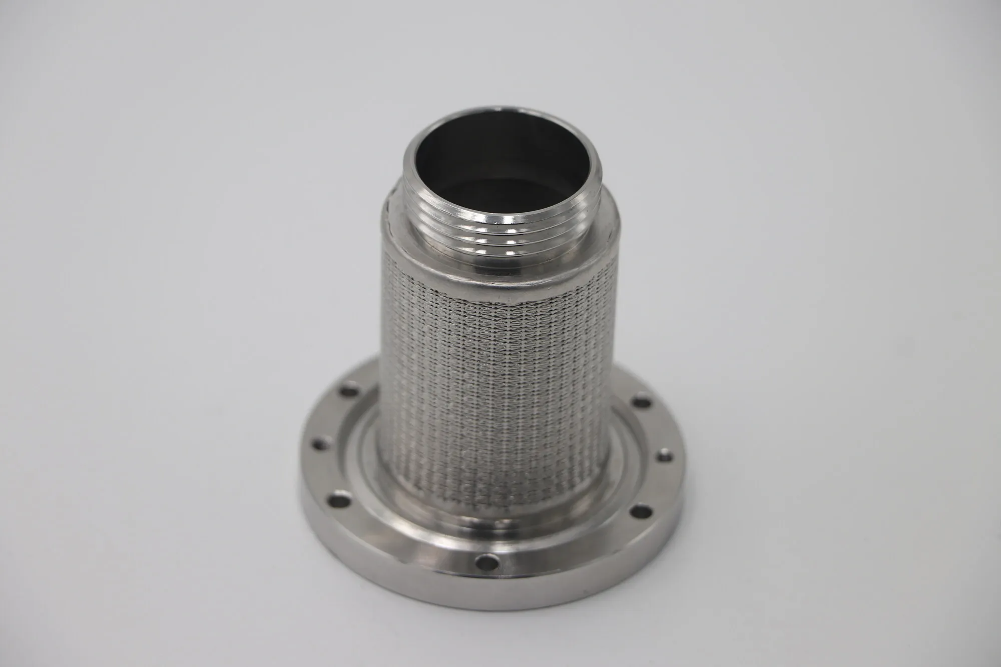 Stainless steel mesh filter cartridge welded to a machined bolt flange
