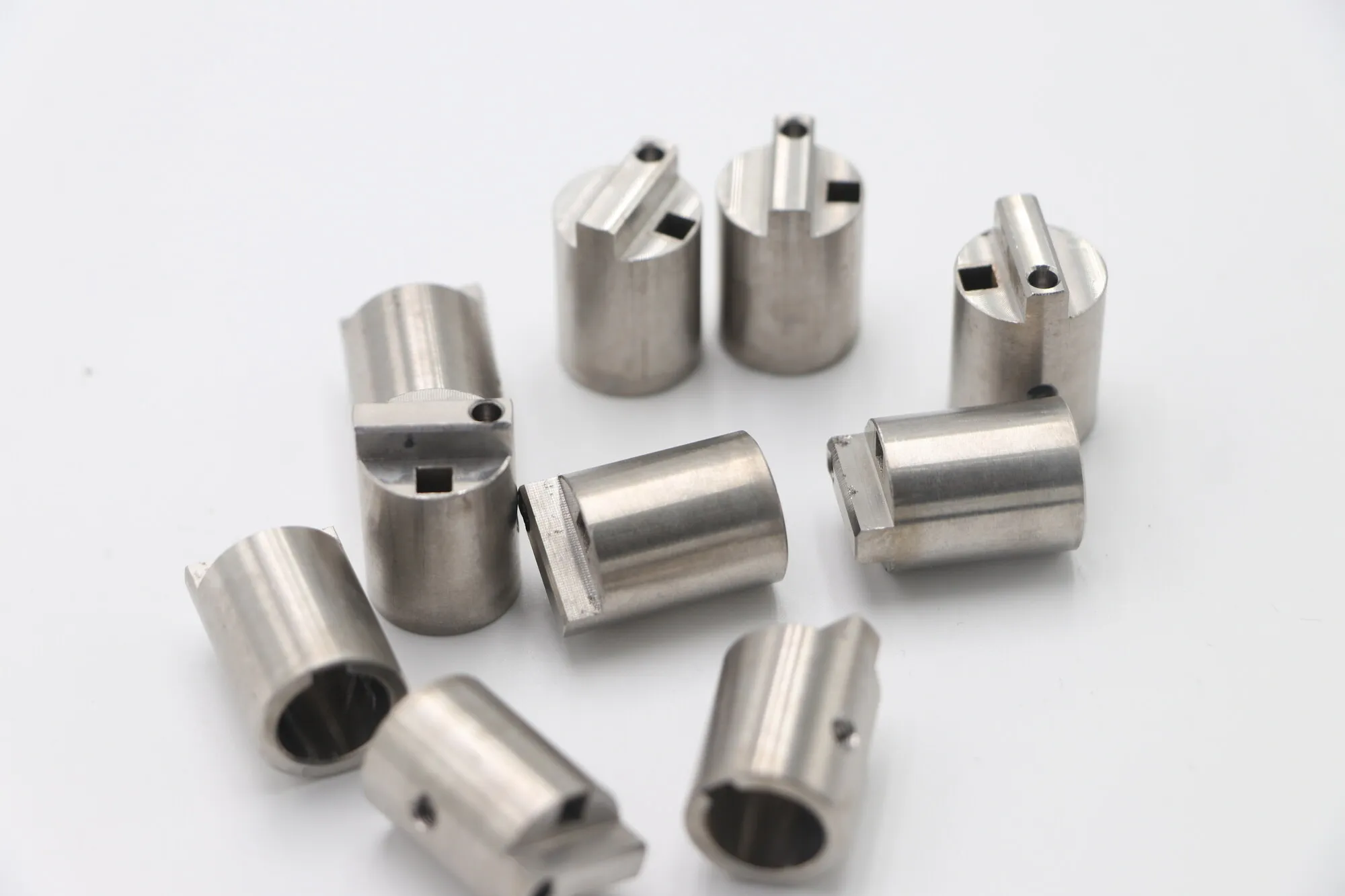CNC turned stainless steel valve cages with milled through-slots