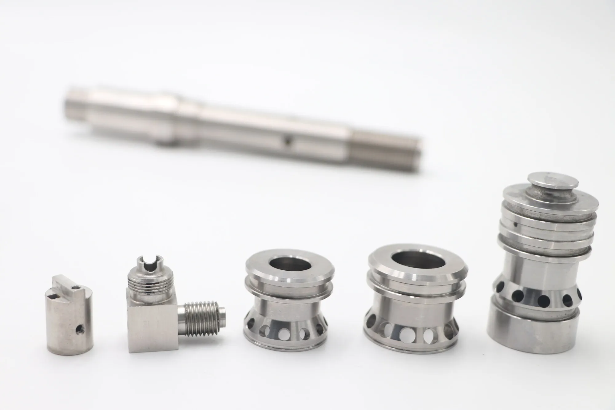 CNC turned stainless steel spool sleeves and shaft with cross-drilled ports