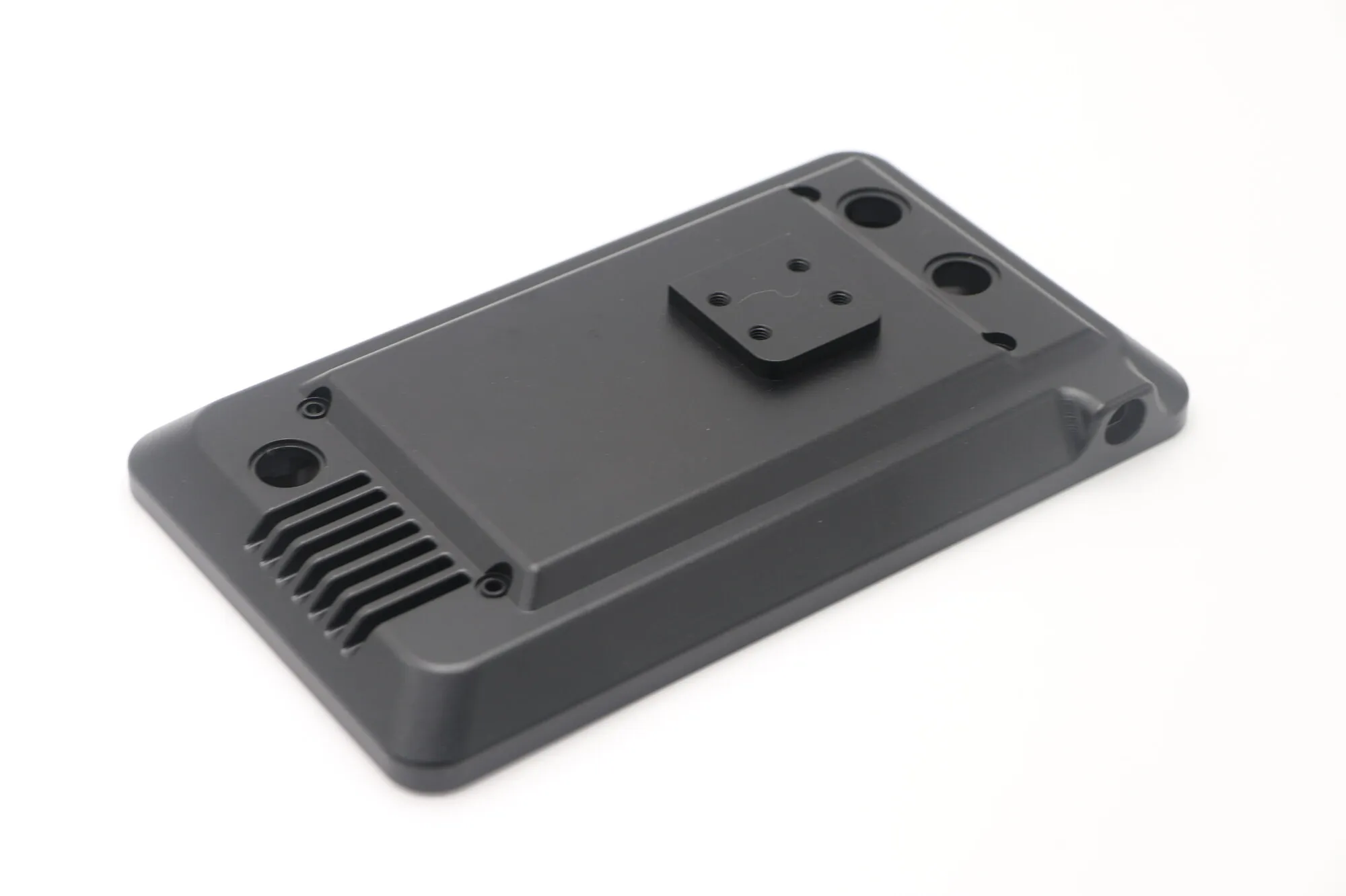 Machined aluminum enclosure body with milled vent slots and black anodized finish